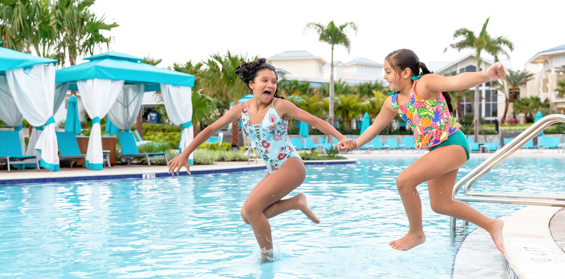 Kids jumping into the pool at Margaritaville Resort Orlando