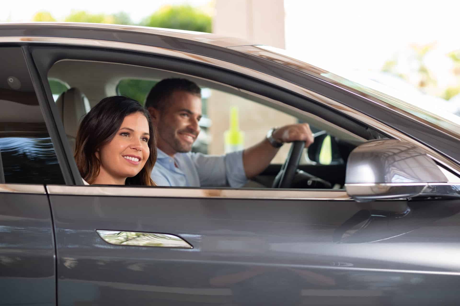 Car Rental 1 Happy couple in a car at the front entrance of Margaritaville Resort Orlando